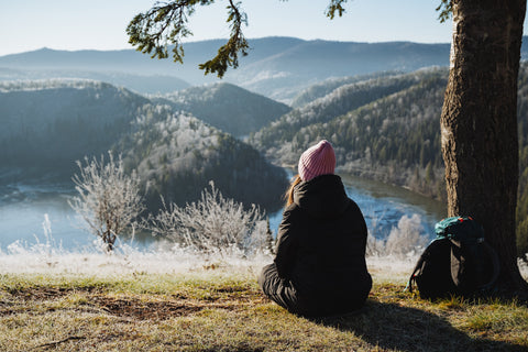 Woman sitting outside practicing the three focus framework